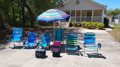 Plenty of gear for the beach!  Chairs, umbrella, cooler and portable speaker 