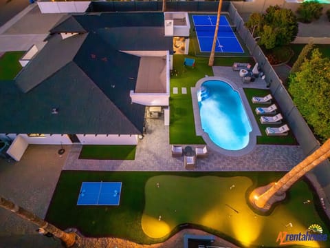 Spectacular aerial view showcasing the complete property with swimming pool, tennis court, and expansive outdoor entertainment areas.