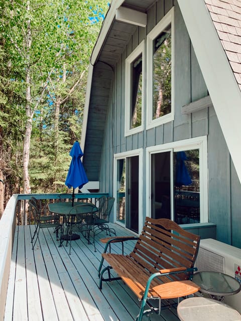 View of the deck with two sliding glass doors on the middle/2nd level.