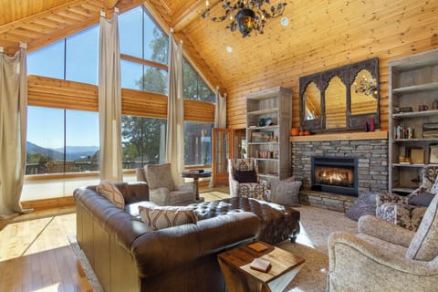 Enjoy dreamy floor-to-ceiling mountain views around the cozy gas fireplace at Westover Lodge!