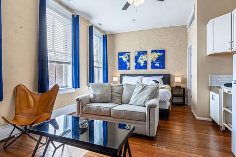 The bright studio combines a comfortable lounge and king sleeping area in one open layout.