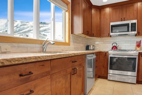 Park City Mountain views from the kitchen, granite countertops and hardwood cabinets