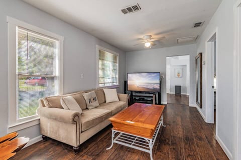 Inviting living area with a smart TV and a cozy couch—perfect for relaxing after a day of adventure.