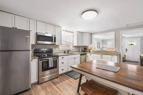 Fully stocked kitchen has ample dishes, glasses, silverware, bowls, pots and pans for quick food on the run or full meals.