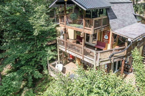 Multiple levels of decks allow peaceful views of the surrounding nature.  Can you hear the creek down the hill?