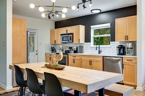 Large dining table offers plenty of space for family dinners and celebrations.