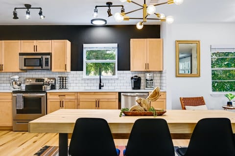 Modern chic dining space with a roomy table—ideal for family dinners and celebrations.