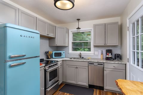 Modern kitchen with upgraded appliances & vintage charm.