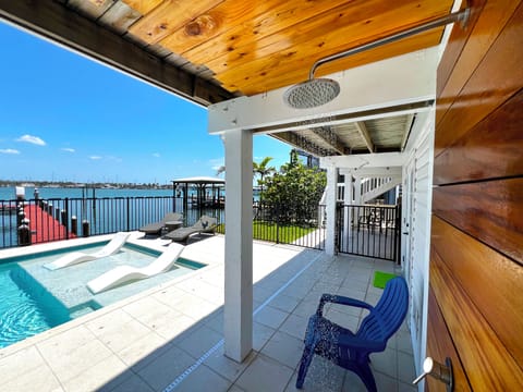 Pool view from patio with large outdoor shower