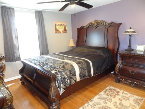 Master bedroom, queen bed, ceiling fan, full closet