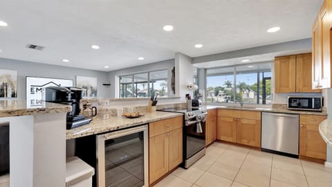 This spacious kitchen features all-new stainless steel appliances, including a refrigerator, stove, oven, microwave, dishwasher, and more!