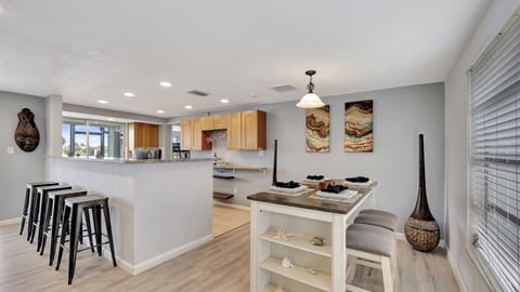 The open-concept dining area is perfectly situated between the living room and kitchen, making mealtime both convenient and enjoyable.