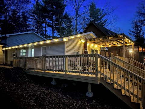 Deck on canal side of house at night