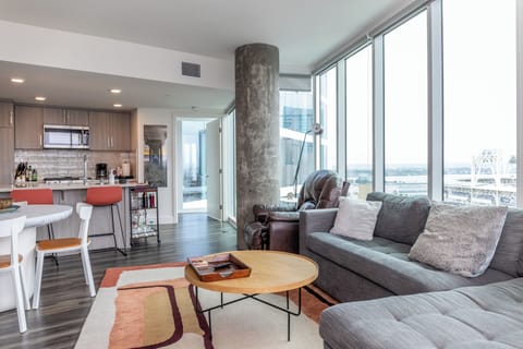 Living Area with wall to ceiling windows and views!