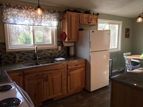 Kitchen windows provide southern view.