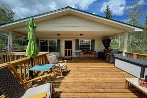 Huge elevated deck with a covered area and large area open to the sunshine.