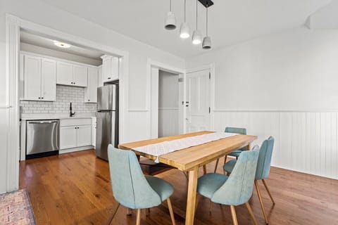 Dining Room with Seating for 6. Looks into kitchen with access to side porch entry