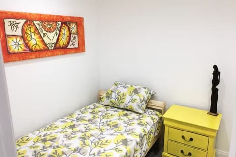 Smaller of the two bedrooms featuring a comfy twin bed. No window.