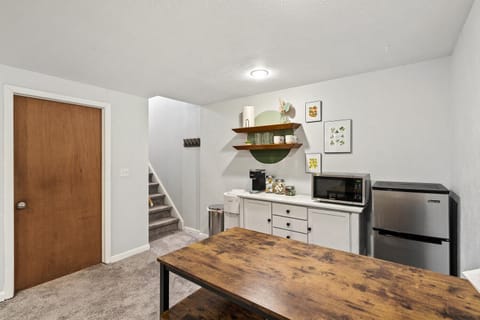 Dining area and entrance with stairs