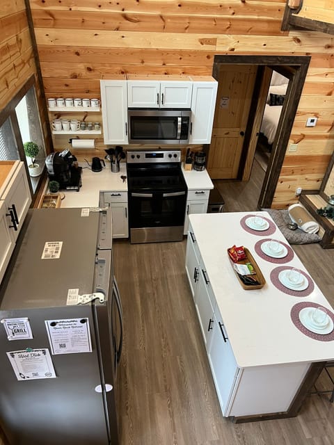 Fully equipped kitchen with modern appliances and island seating