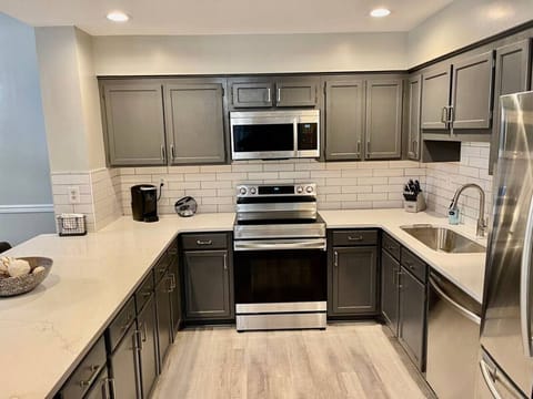 Gorgeous kitchen stocked with everything you would need for cooking in your lake and mountain getaway.  Everything is brand new: stainless appliances, custom quartz countertops, kitchen cabinets, etc.