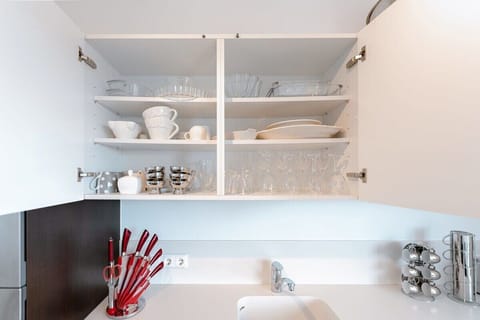 Our kitchen cabinets: stocked with essentials for your dining pleasure.