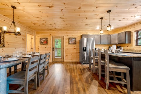 The kitchen and dining area are located behind the first-floor living room.