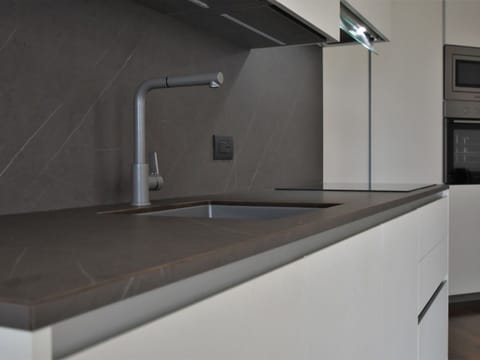 Building, Cabinetry, Countertop, Tap, Flooring, Kitchen Appliance, Automotive Exterior, Wood, House, Major Appliance