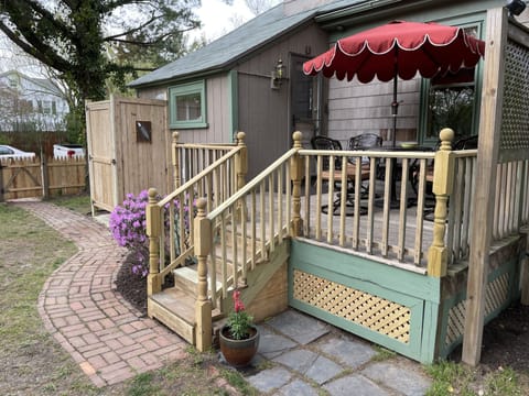 Deck overlooking rear garden with outside shower for return from the beach!