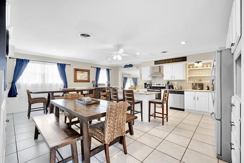Open and spacious Dining Area + Kitchen. Two dining tables + island can seat 20.