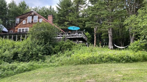 Deck overlooking garden and forest 
