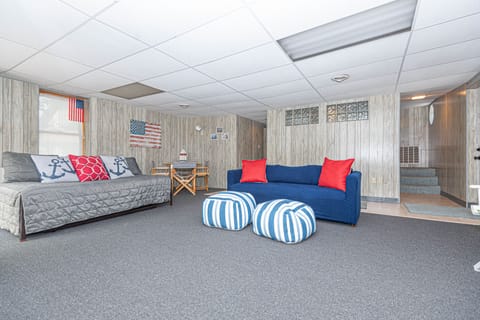ground floor family room and stairway to upper main floor 