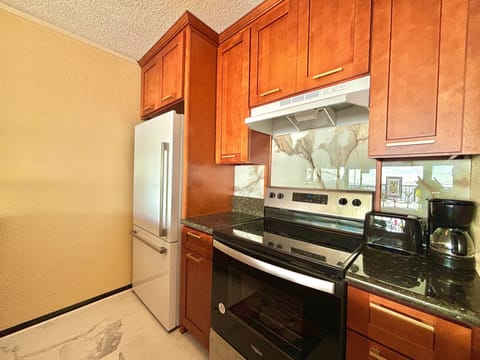 New appliances and gorgeous wood kitchen cabinets