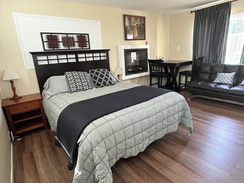 Enjoy your evenings in a comfortable queen bed next to the electric fireplace.