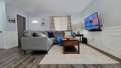 Comfortable Living Room has a 55" 4K smart TV and lift top coffee table