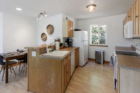 The kitchen has all the cookware and dishes you'll need for a party of 12!