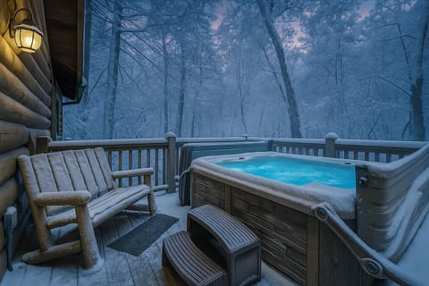 Private hot tub on snowy deck, perfect for cozy mountain nights