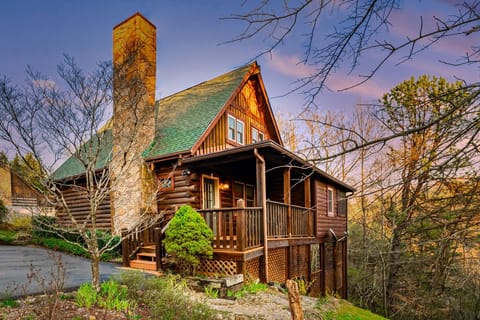 Nestled within the majestic Smokey Mountain forest, the homey cabin awaits your arrival. 