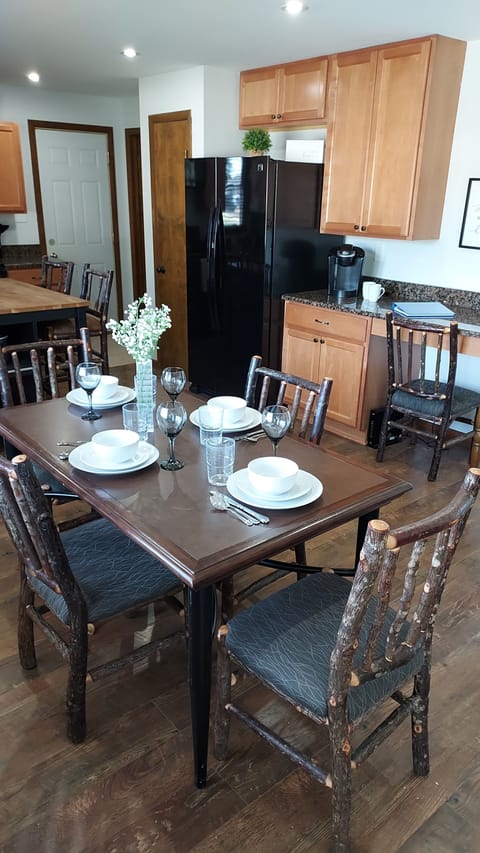Dining table looking into kitchen area