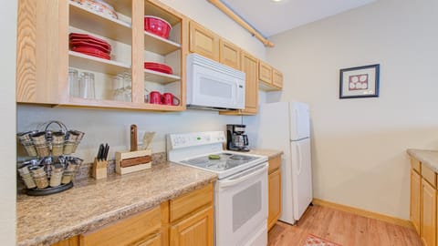 The kitchen is stocked with all the essentials, from basic spices and coffee to pots, pans and baking dishes.