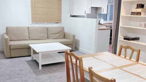 Living & dining room; dining table with 6 chairs; wall shelf with dinnerware 