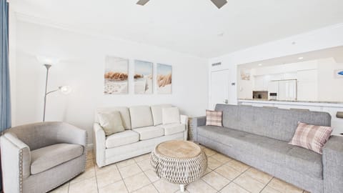 Open concept living area with sleeper sofa and balcony access + TV (sleeps 2)