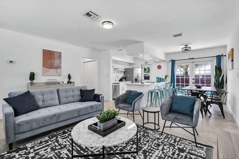“Bright living and dining space with chic décor—ideal for gathering during your vacation rental stay.”