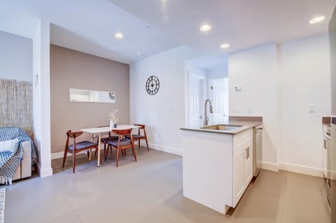 Kitchen to the right, dining area to the back, and living room to the left. 