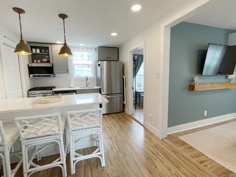 Kitchen area with bedroom and living room off to the side