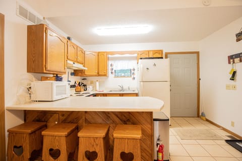 Spacious eat-in kitchen with island seating and a table for up to 10 total diners.