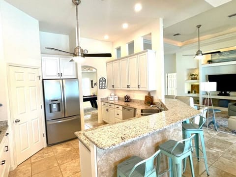 Embrace the joy of preparing meals with your loved ones in our generous kitchen space.