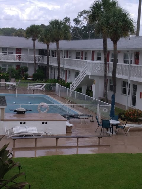 View of heated pool from front door