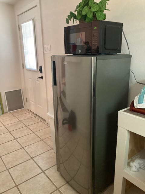 Entrance door comes into kitchenette with medium fridge & microwave