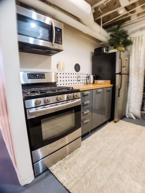 Gas stove and oven, full sized refridgerator.